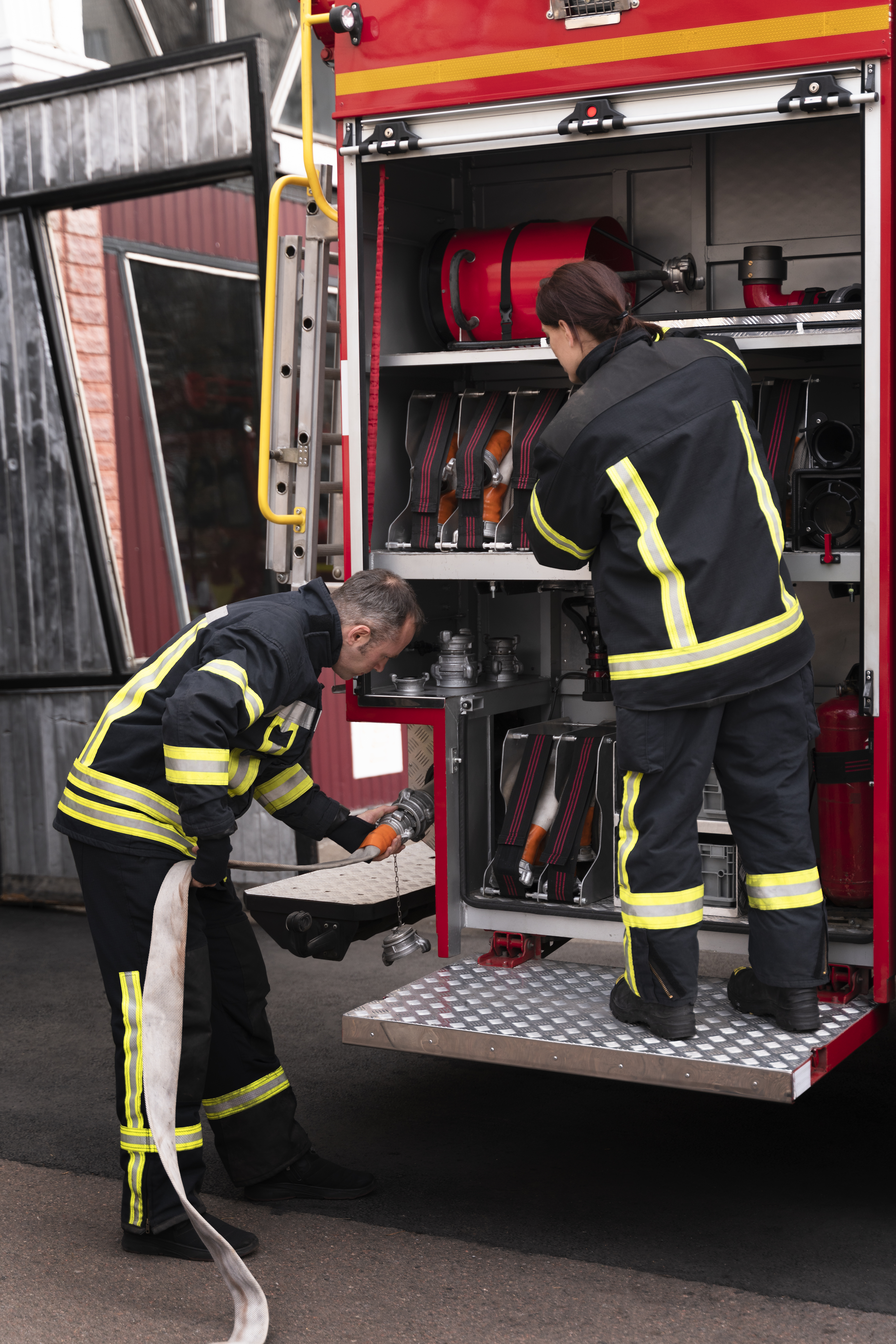 Emergency services crew carrying equipment